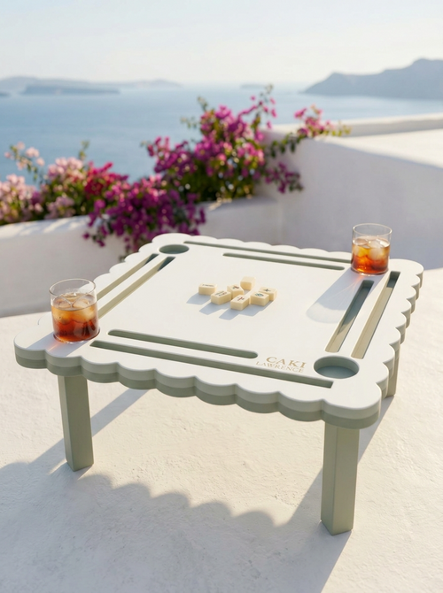White Cloister colorway mahjong travel table on a Greek terrace overlooking the sea
