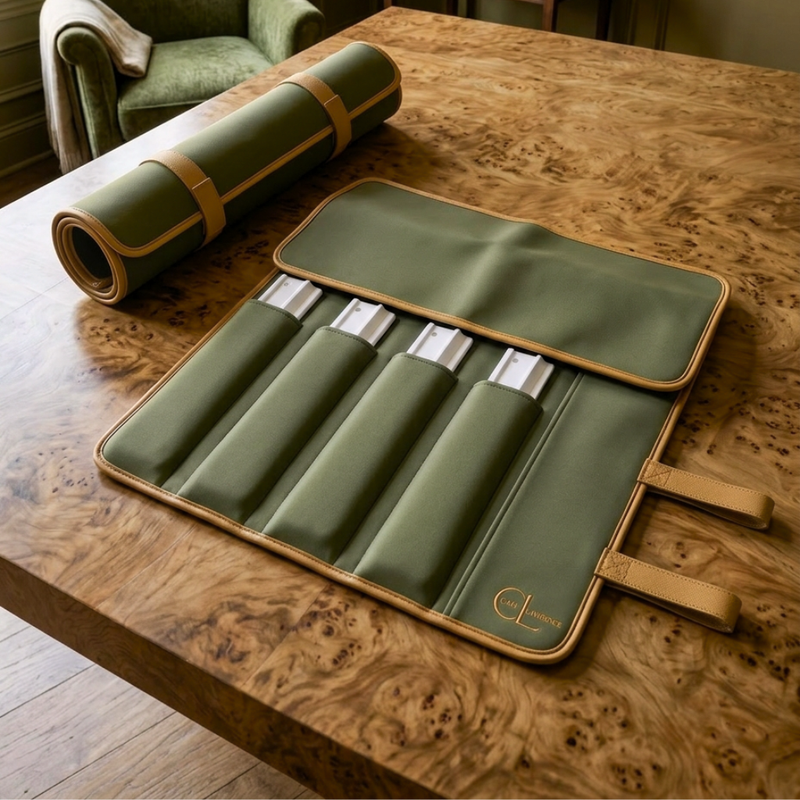 Caki Lawrence mahjong rack roll in neoprene olive green with orange stitching and piping with 'CAKI LAWRENCE' stacked logomark embroidered sitting on a burlwood table open