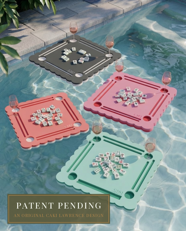 The Parlor Companion in three colorways floating together in a pool — portable mahjong table by Caki Lawrence